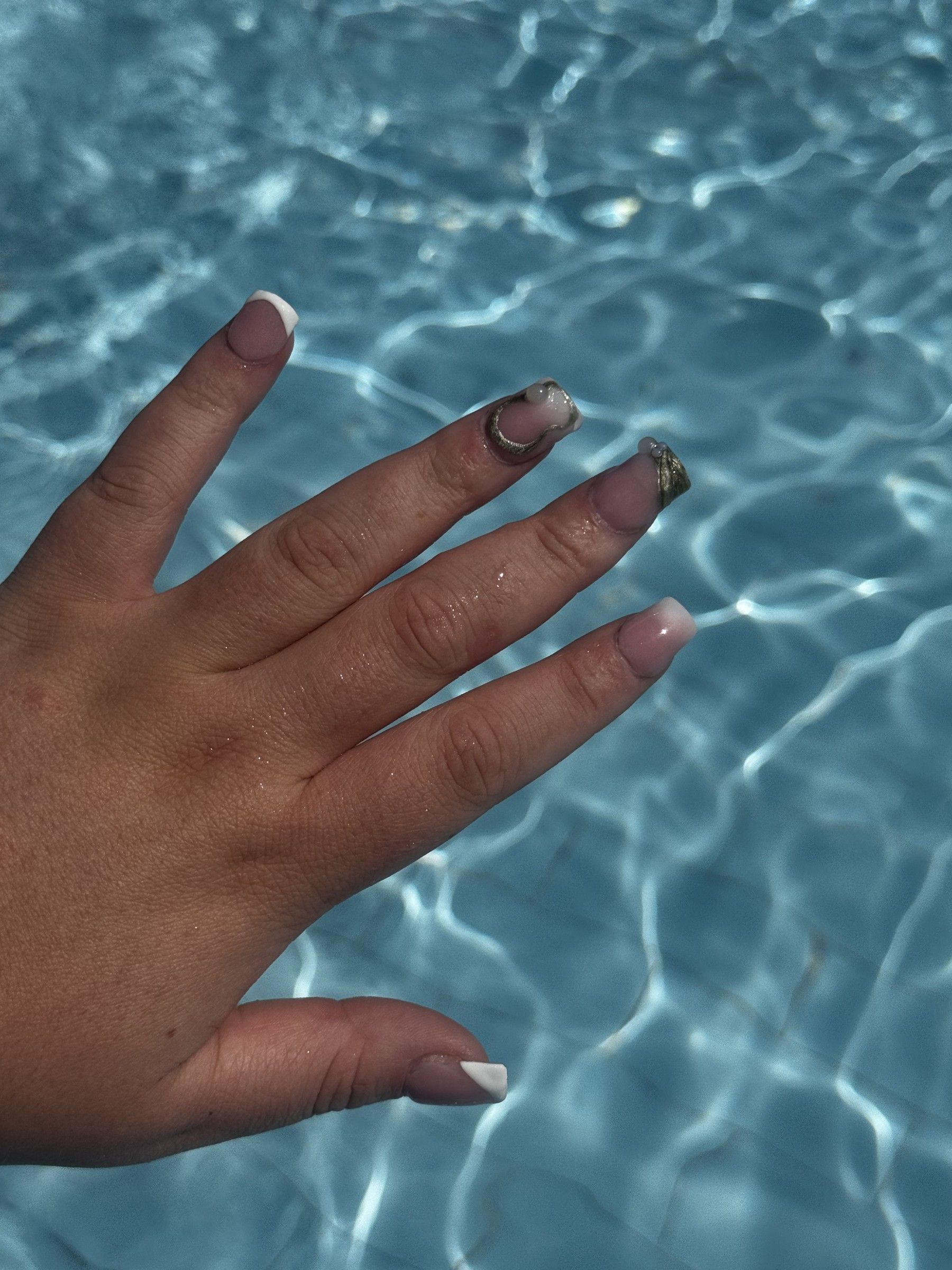 Acrylic nails with chrome and glitter tips