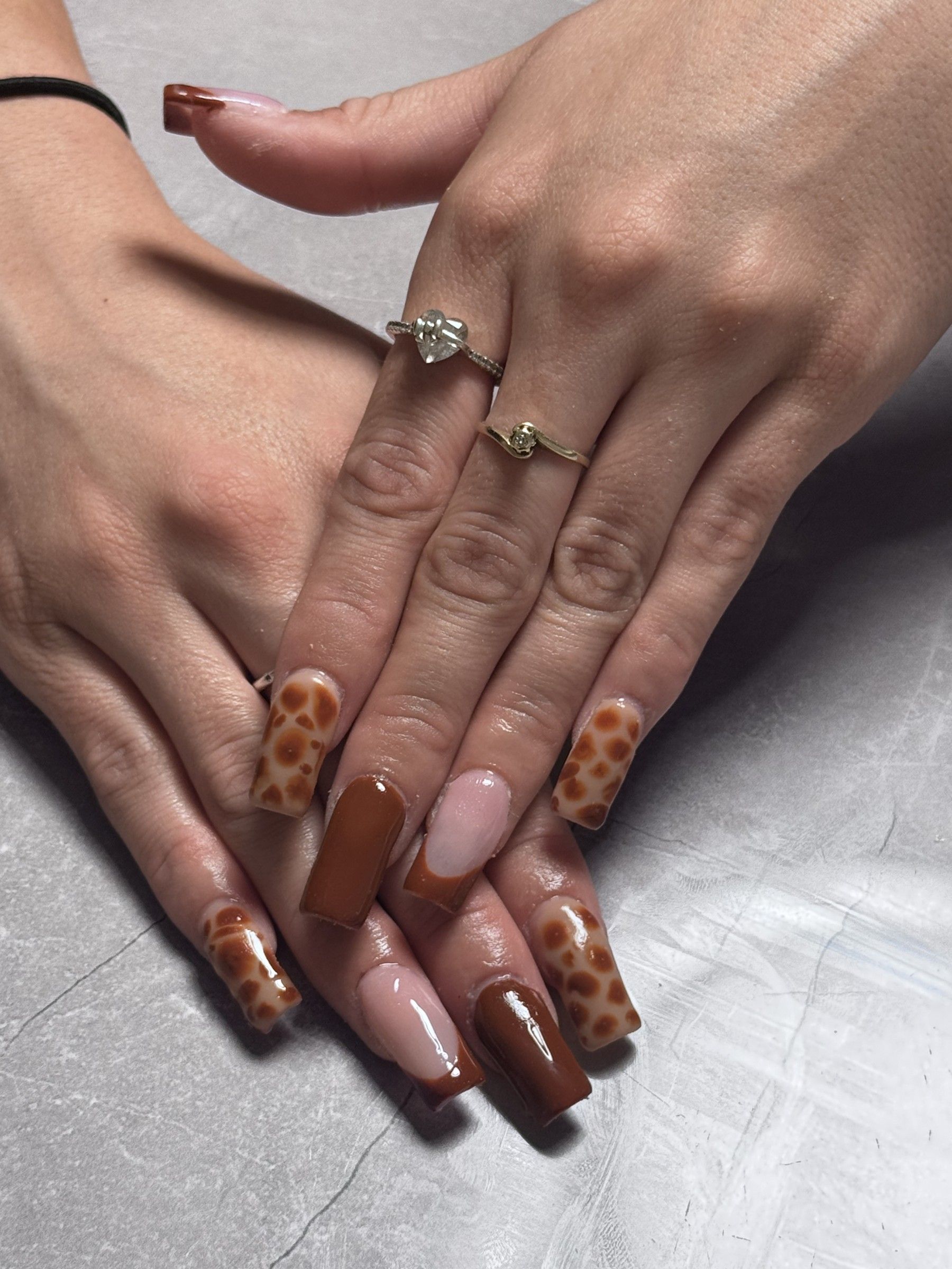 Long square acrylic nails with brown leopard print and a nude French accent
